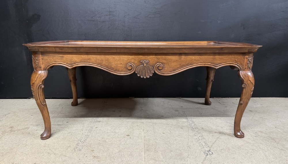 A burr walnut low coffee table featuring cabriole legs, a carved shell motif on the central apron, and a raised moulded edge around the top. View XIII
