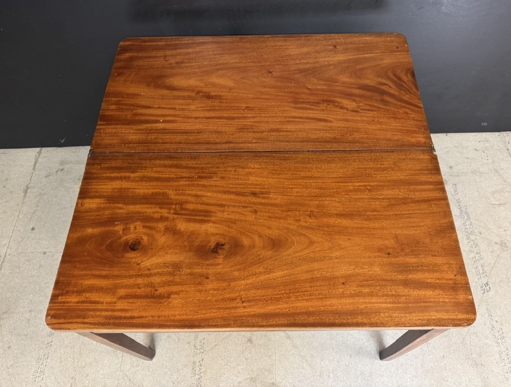 A rectangular Georgian mahogany fold-over tea table featuring fine boxwood string inlay and straight tapered legs. View VI
