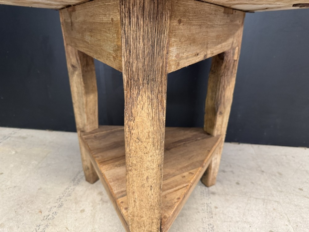 A rustic antique pine cricket table featuring a circular wooden top supported by three sturdy legs and a low triangular shelf. View IX