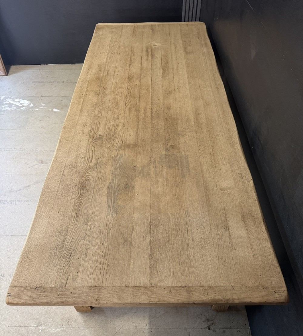 Large rectangular light oak farmhouse dining table featuring turned legs and an H-stretcher base. View VI