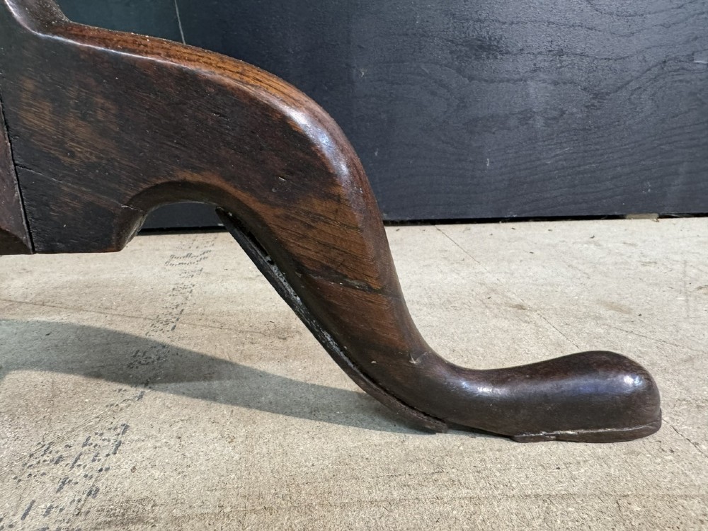 A Georgian solid oak tilt-top table with a circular surface supported by a turned pedestal column and three cabriole tripod legs. View VI