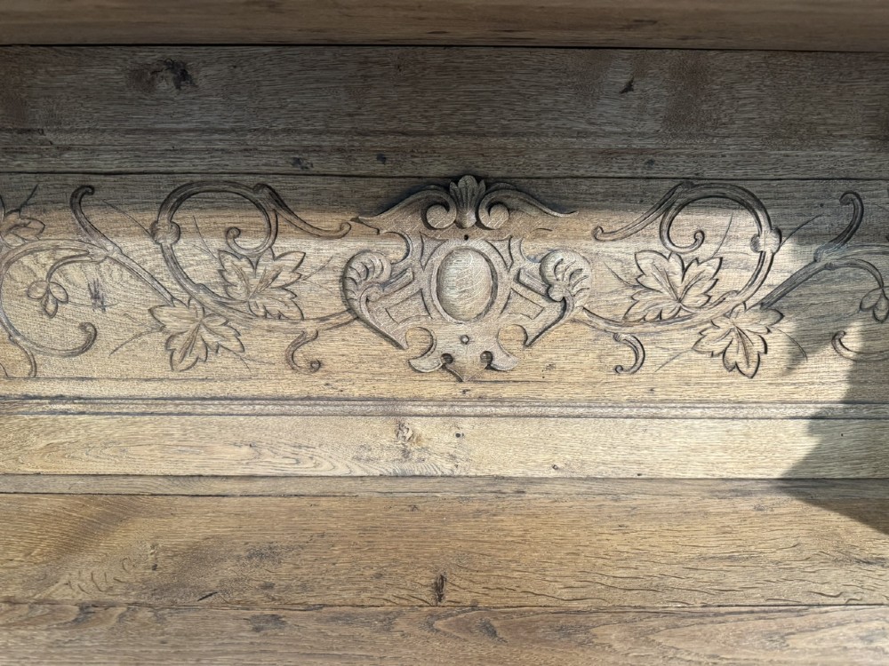 A 19th-century French carved oak buffet featuring an ornate crest, open shelf, turned columns, and carved drawers. View V