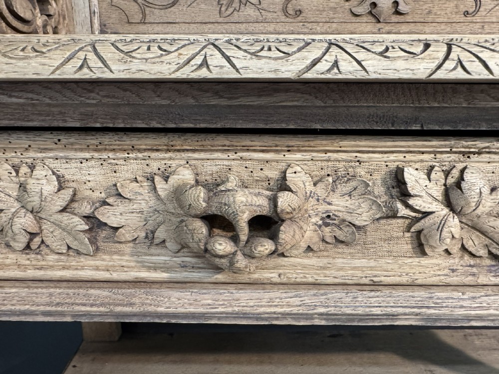 A 19th-century French carved oak buffet featuring an ornate crest, open shelf, turned columns, and carved drawers. View XIII