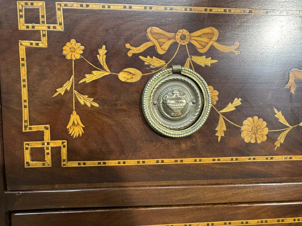 An 18th-century Dutch mahogany tall chest of drawers featuring intricate floral marquetry inlay across six drawers with brass handles. View XI
