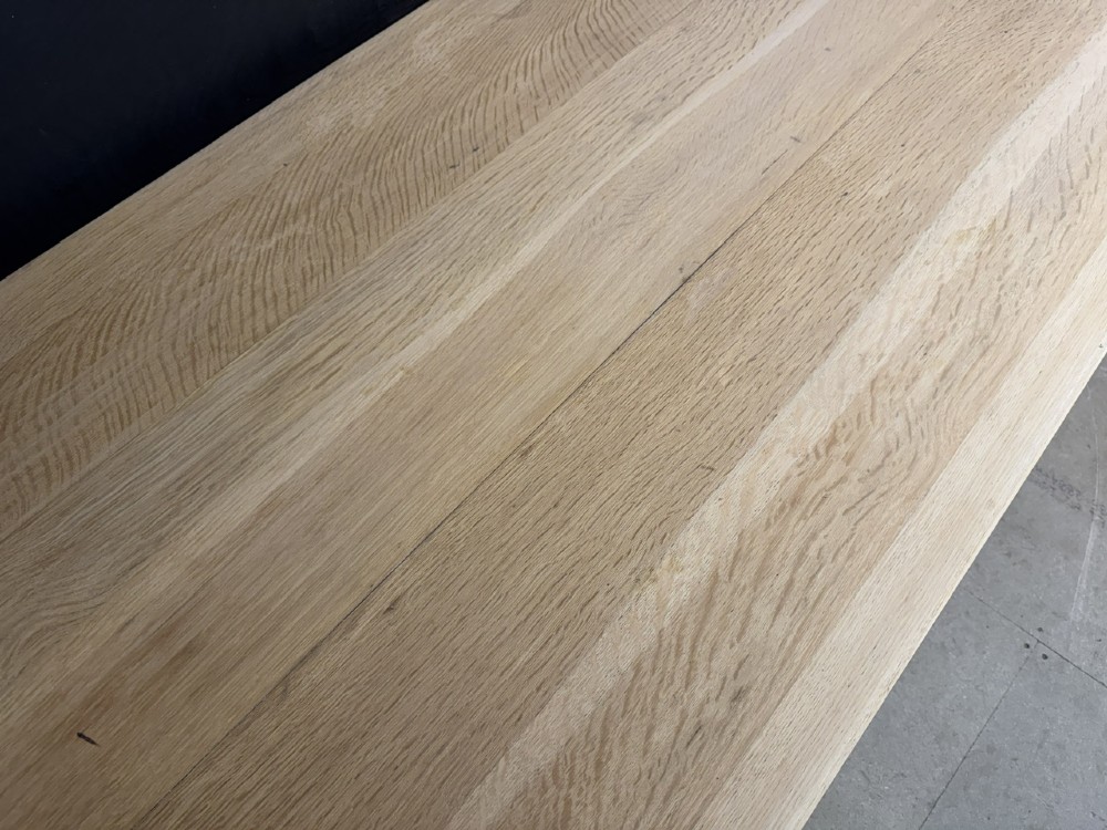 A rectangular light oak dining table featuring clean straight edges, a planked top, and simple tapered legs against a neutral background. View XI