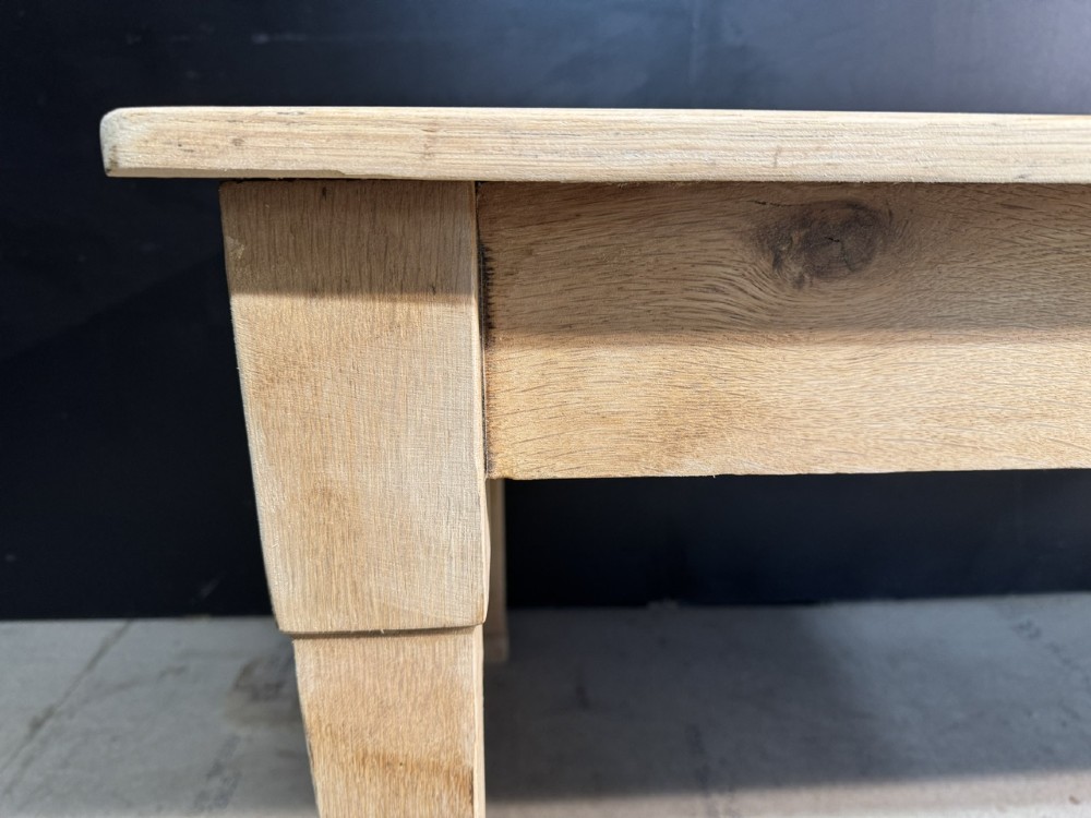 A rectangular light oak dining table featuring clean straight edges, a planked top, and simple tapered legs against a neutral background. View XIII