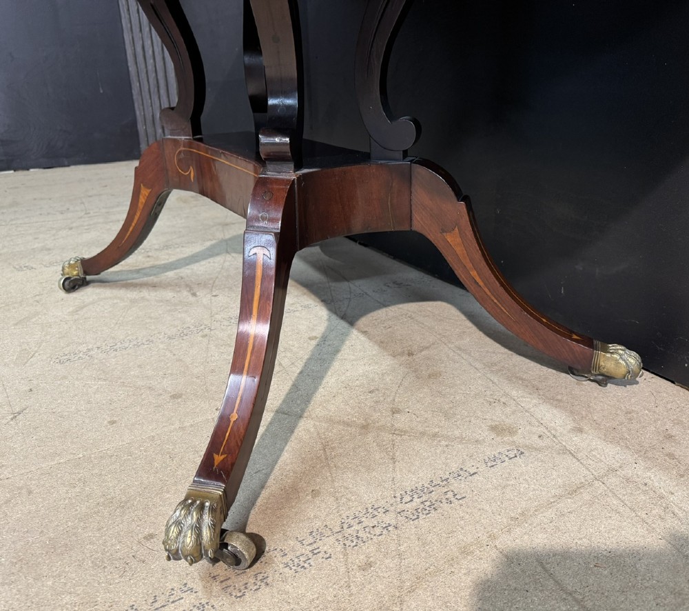 A Georgian mahogany sofa table featuring two inline drawers with satinwood string inlay, drop leaves, twin-pillar supports, and splayed legs ending in brass claw feet on castors. View VII