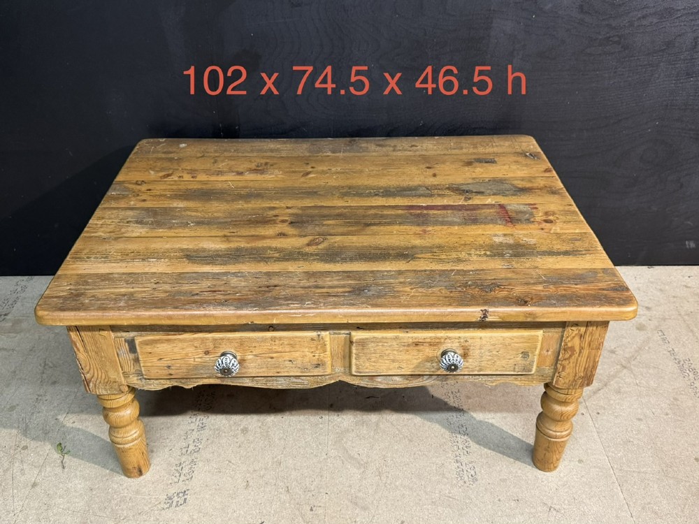 A rectangular rustic pine coffee table featuring a plank top, two front drawers with decorative ceramic knobs, and four turned wooden legs. View VIII