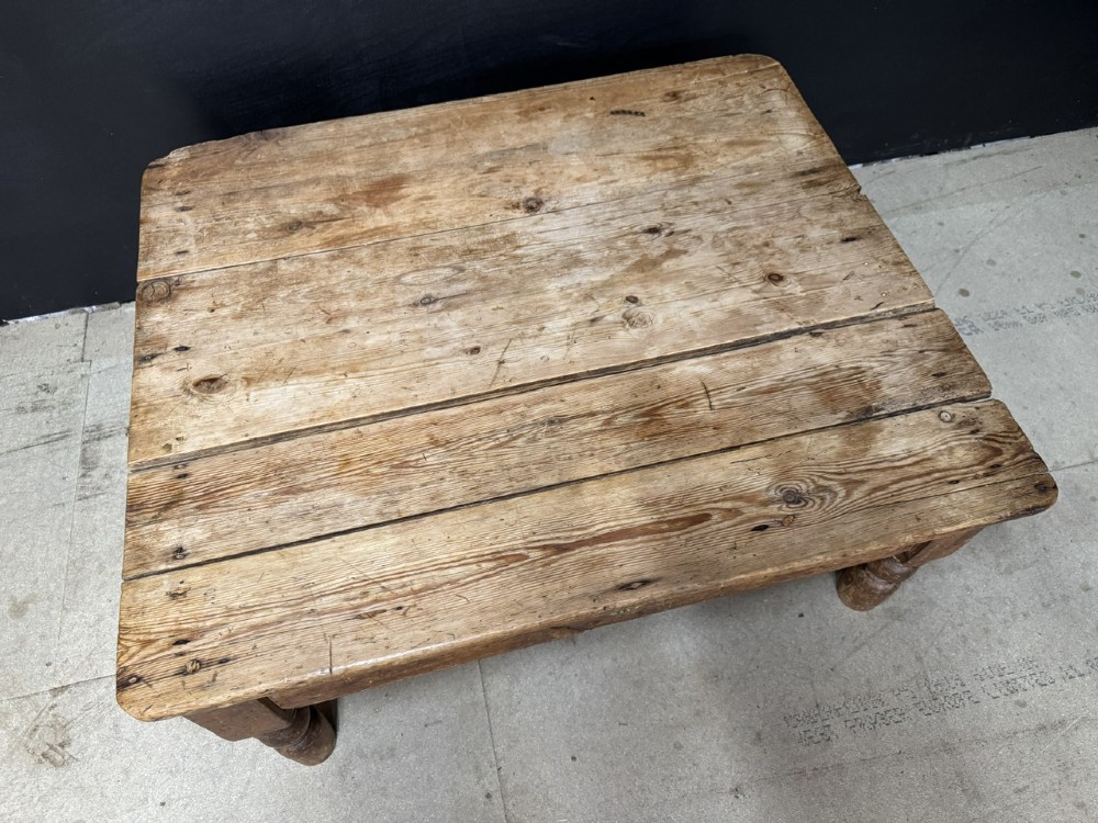A low rectangular rustic pine coffee table featuring a plank top, turned corner legs, and a single central drawer with a brass drop handle. View IV