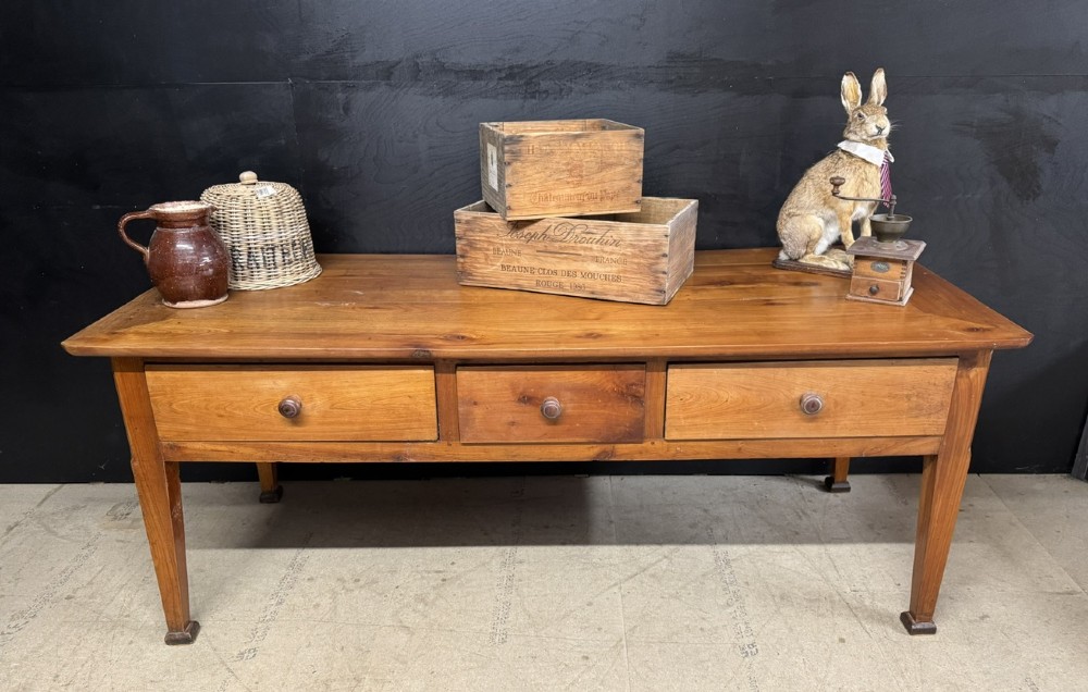 An 18th-century French provincial wooden console table featuring three frieze drawers with wooden turned knobs and four tapered square legs. View II