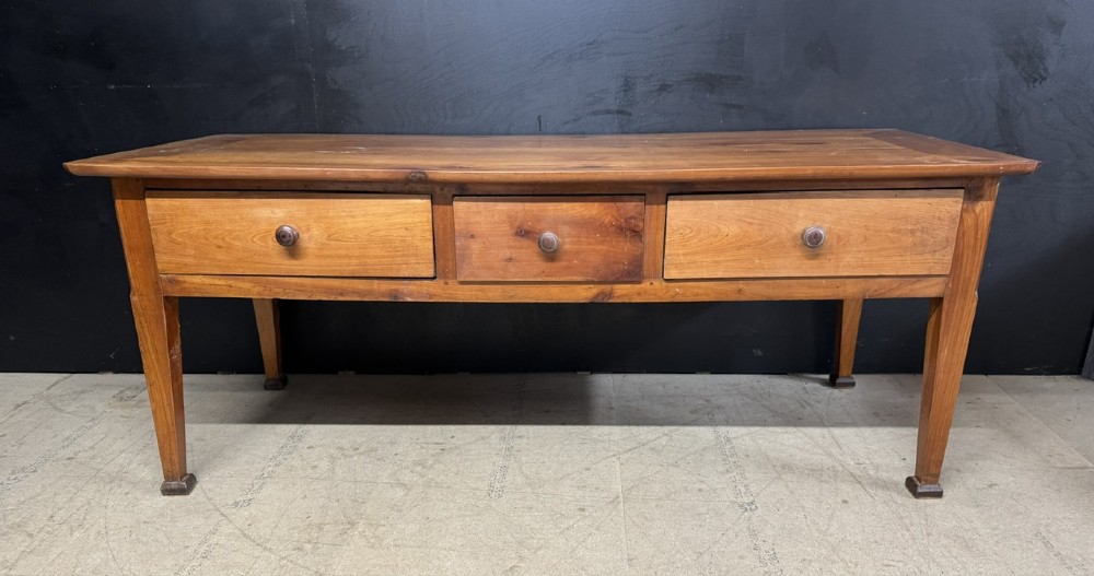 An 18th-century French provincial wooden console table featuring three frieze drawers with wooden turned knobs and four tapered square legs. View III