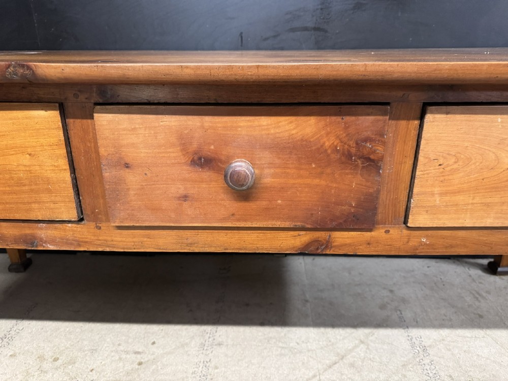 An 18th-century French provincial wooden console table featuring three frieze drawers with wooden turned knobs and four tapered square legs. View VII