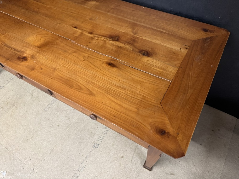 An 18th-century French provincial wooden console table featuring three frieze drawers with wooden turned knobs and four tapered square legs. View VIII