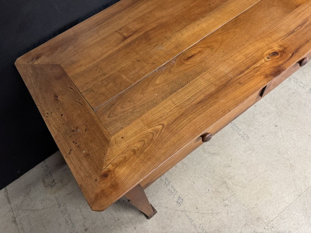 An 18th-century French provincial wooden console table featuring three frieze drawers with wooden turned knobs and four tapered square legs. View IX