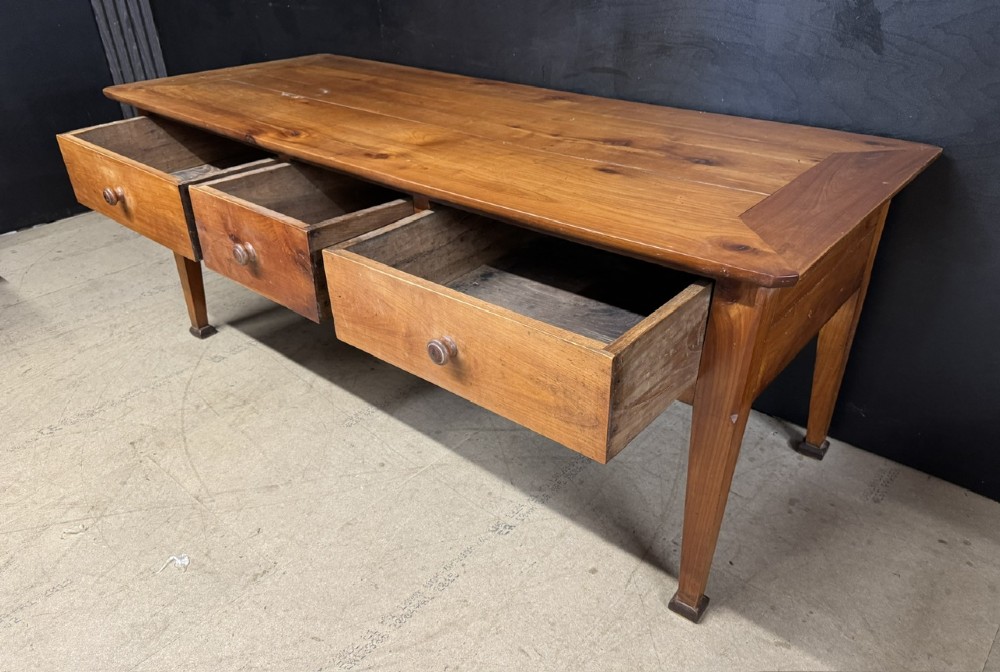 An 18th-century French provincial wooden console table featuring three frieze drawers with wooden turned knobs and four tapered square legs. View XI