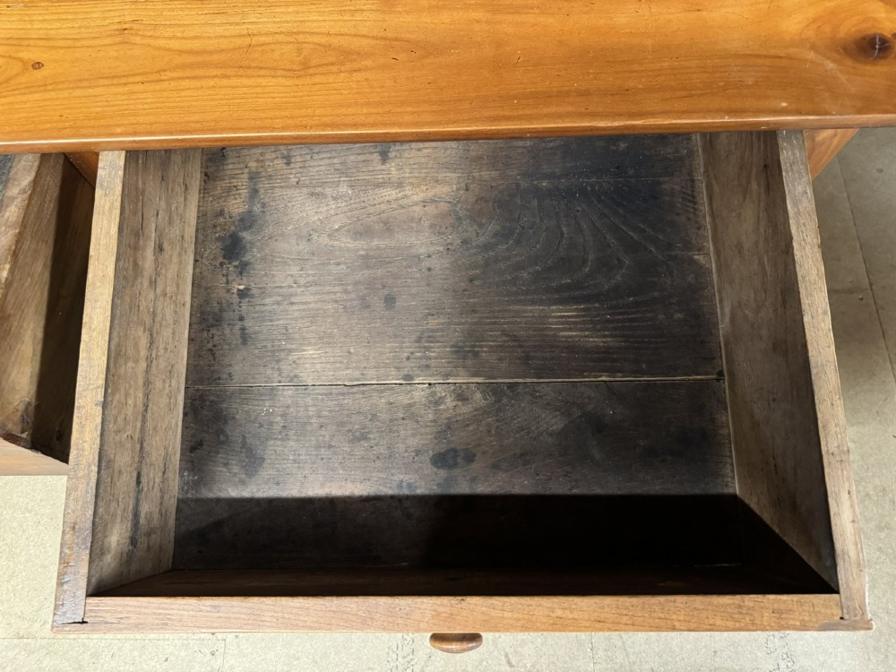 An 18th-century French provincial wooden console table featuring three frieze drawers with wooden turned knobs and four tapered square legs. View XIII