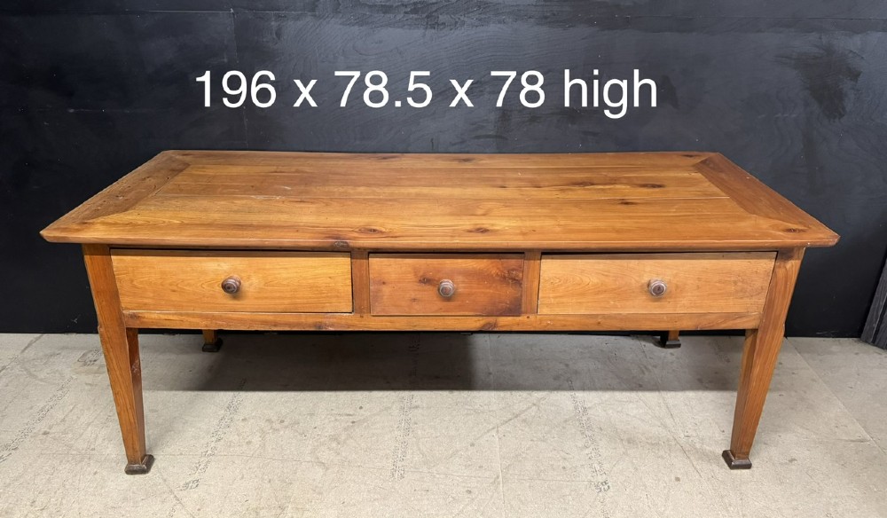 An 18th-century French provincial wooden console table featuring three frieze drawers with wooden turned knobs and four tapered square legs. View XIV