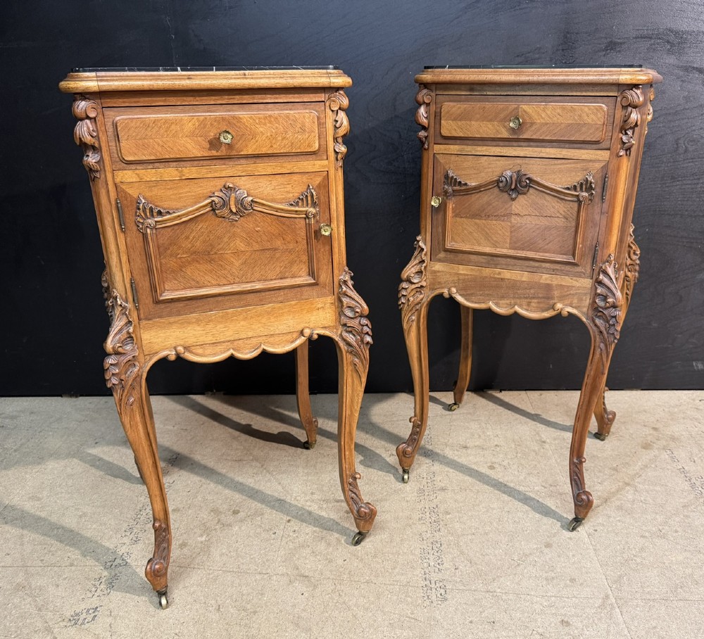 A pair of French walnut bedside cabinets with carved cabriole legs, dark marble tops, single drawers, and cupboard doors. View II
