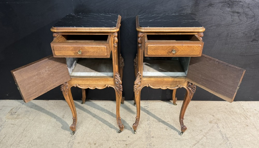 A pair of French walnut bedside cabinets with carved cabriole legs, dark marble tops, single drawers, and cupboard doors. View VI