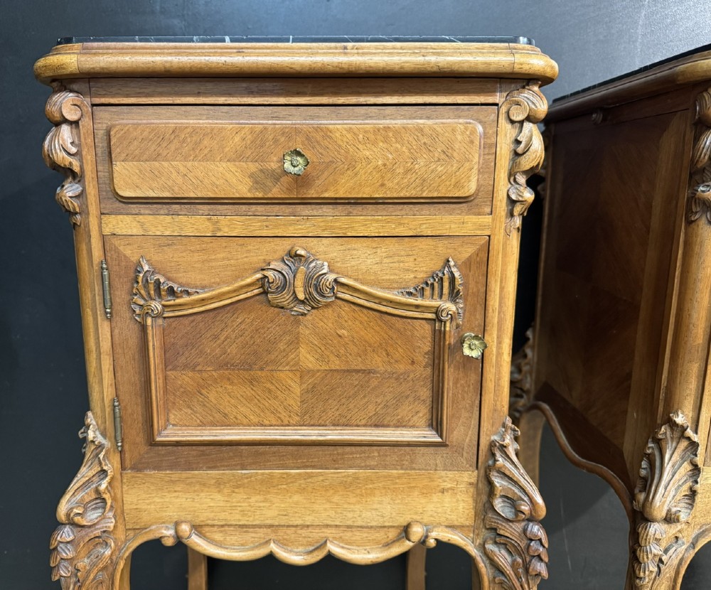 A pair of French walnut bedside cabinets with carved cabriole legs, dark marble tops, single drawers, and cupboard doors. View VII
