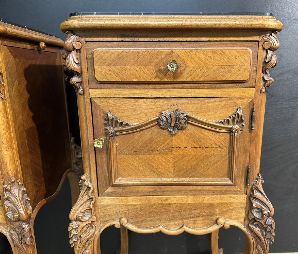 A pair of French walnut bedside cabinets with carved cabriole legs, dark marble tops, single drawers, and cupboard doors. View VIII
