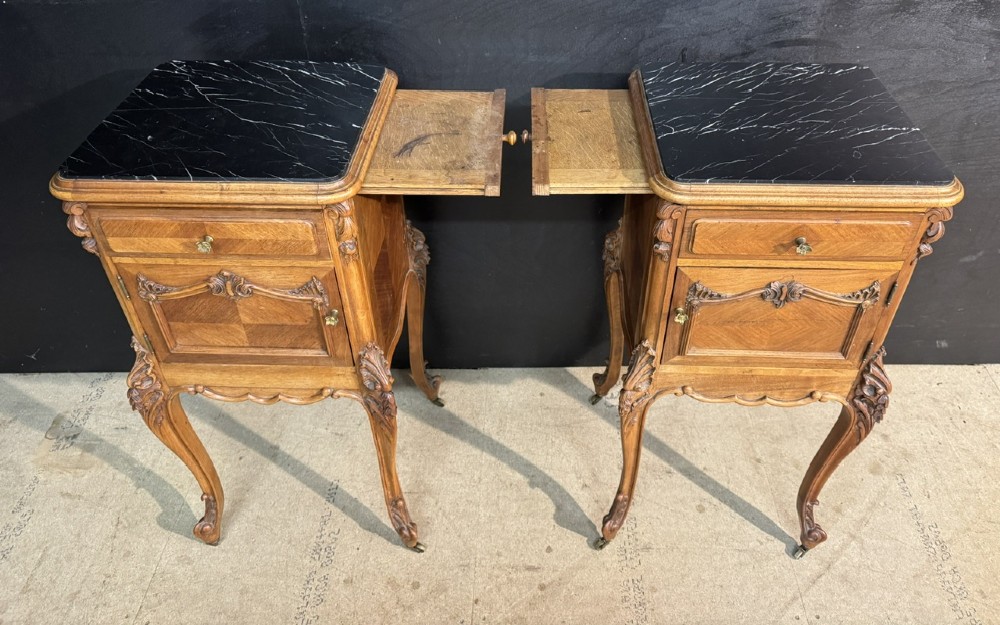 A pair of French walnut bedside cabinets with carved cabriole legs, dark marble tops, single drawers, and cupboard doors. View XII