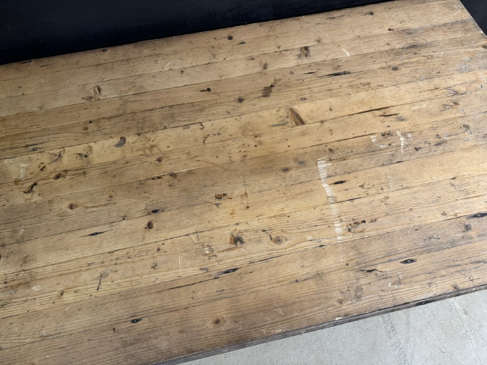 A rustic natural pine farmhouse kitchen table featuring a plank top, a single apron drawer, square legs, and a low stretcher base. View VII