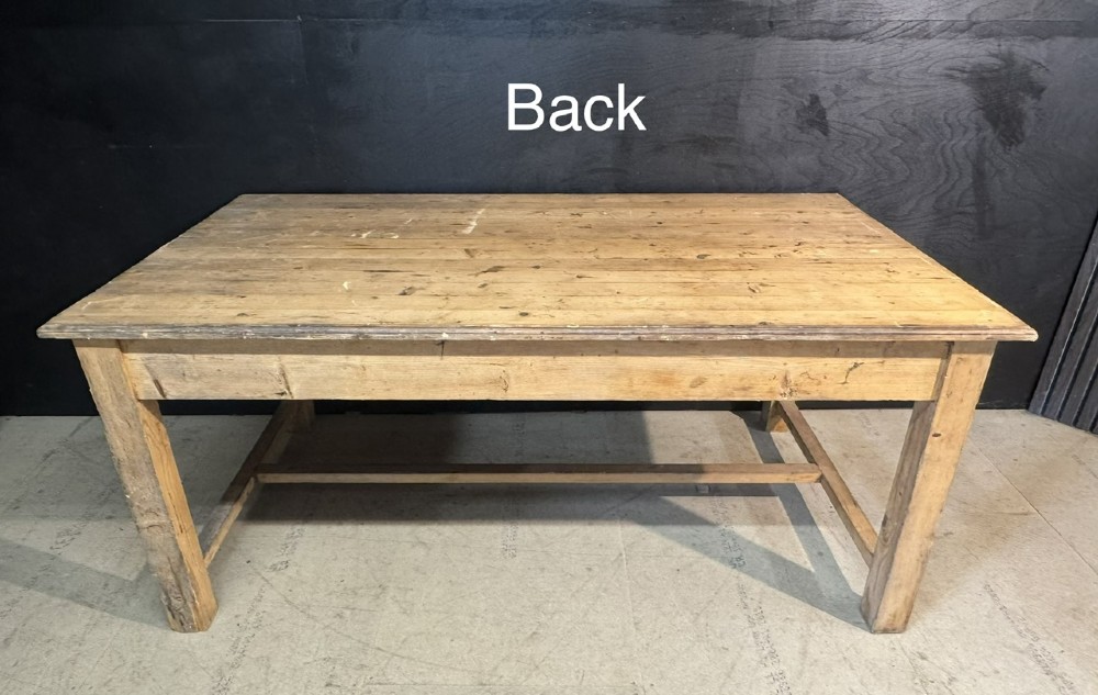 A rustic natural pine farmhouse kitchen table featuring a plank top, a single apron drawer, square legs, and a low stretcher base. View XIII