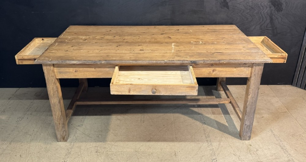A rustic natural pine farmhouse kitchen table featuring a plank top, a single apron drawer, square legs, and a low stretcher base. View XV
