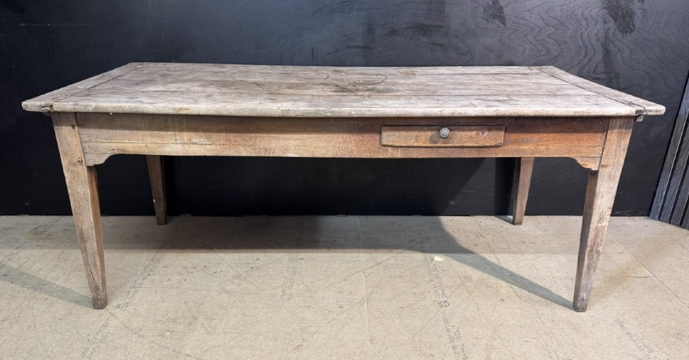 A rustic French provincial kitchen table featuring a scrubbed timber plank top, a single frieze drawer with a small knob, and four tapered square legs. View III