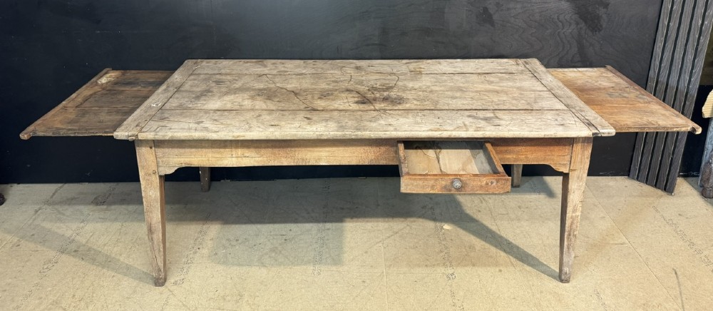 A rustic French provincial kitchen table featuring a scrubbed timber plank top, a single frieze drawer with a small knob, and four tapered square legs. View IV