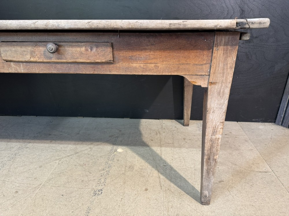 A rustic French provincial kitchen table featuring a scrubbed timber plank top, a single frieze drawer with a small knob, and four tapered square legs. View VIII