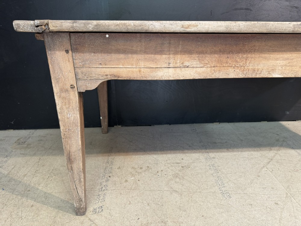 A rustic French provincial kitchen table featuring a scrubbed timber plank top, a single frieze drawer with a small knob, and four tapered square legs. View X