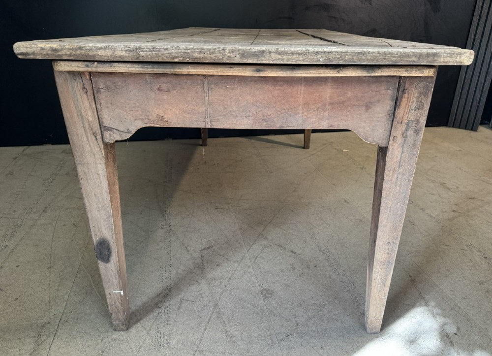A rustic French provincial kitchen table featuring a scrubbed timber plank top, a single frieze drawer with a small knob, and four tapered square legs. View XIII