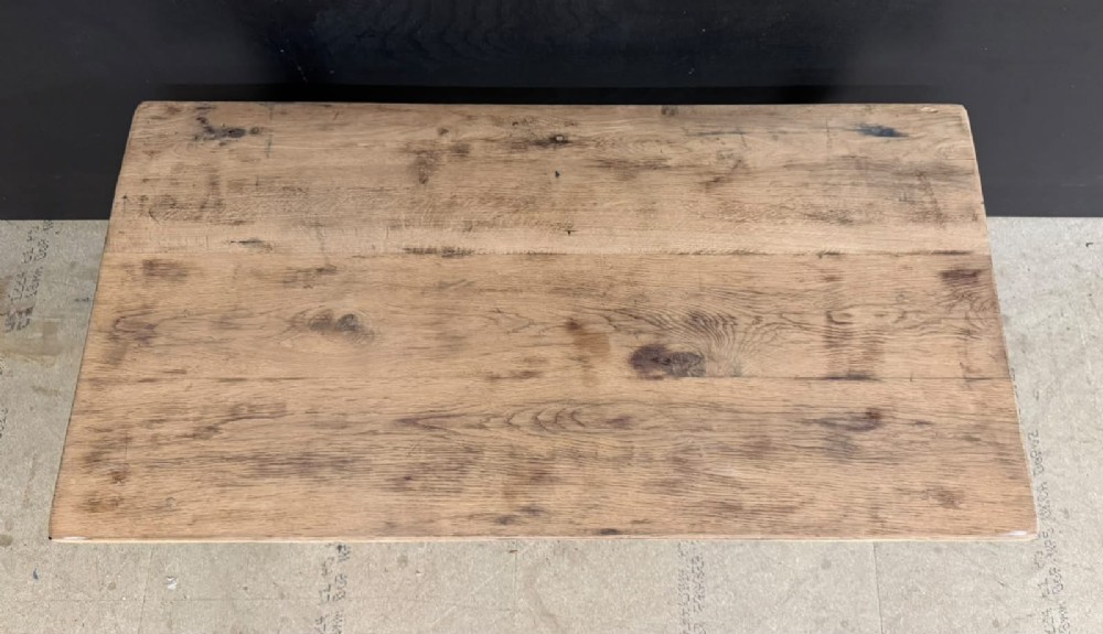 A low French oak coffee table with a rectangular light wood plank top, a single frieze drawer, and tapered square legs. View III