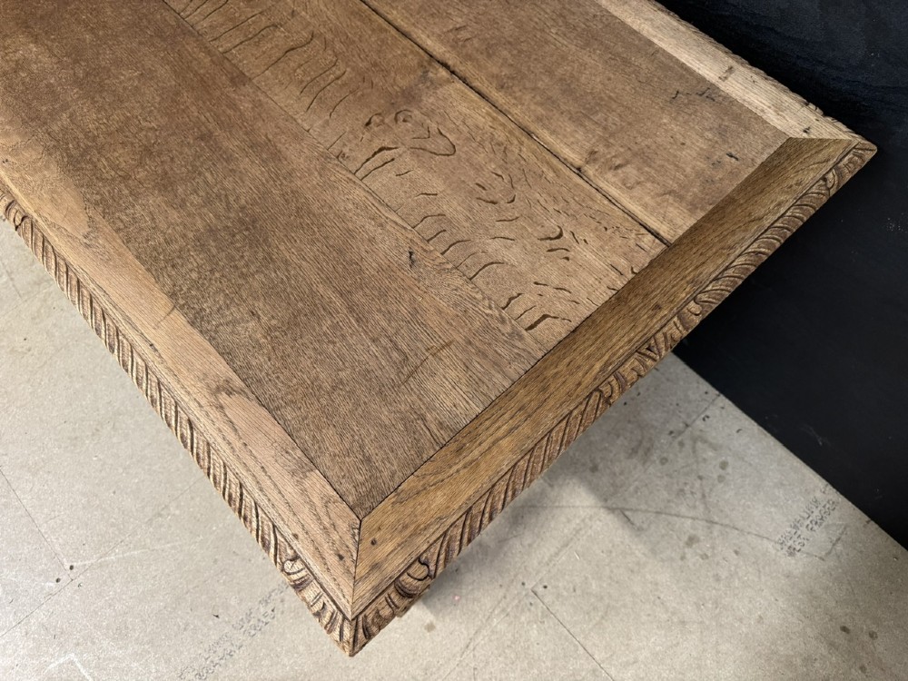 A French bleached oak writing desk featuring hand-carved floral drawer fronts, egg-and-dart moulding, turned barley twist legs, and an H-stretcher base. View XIII