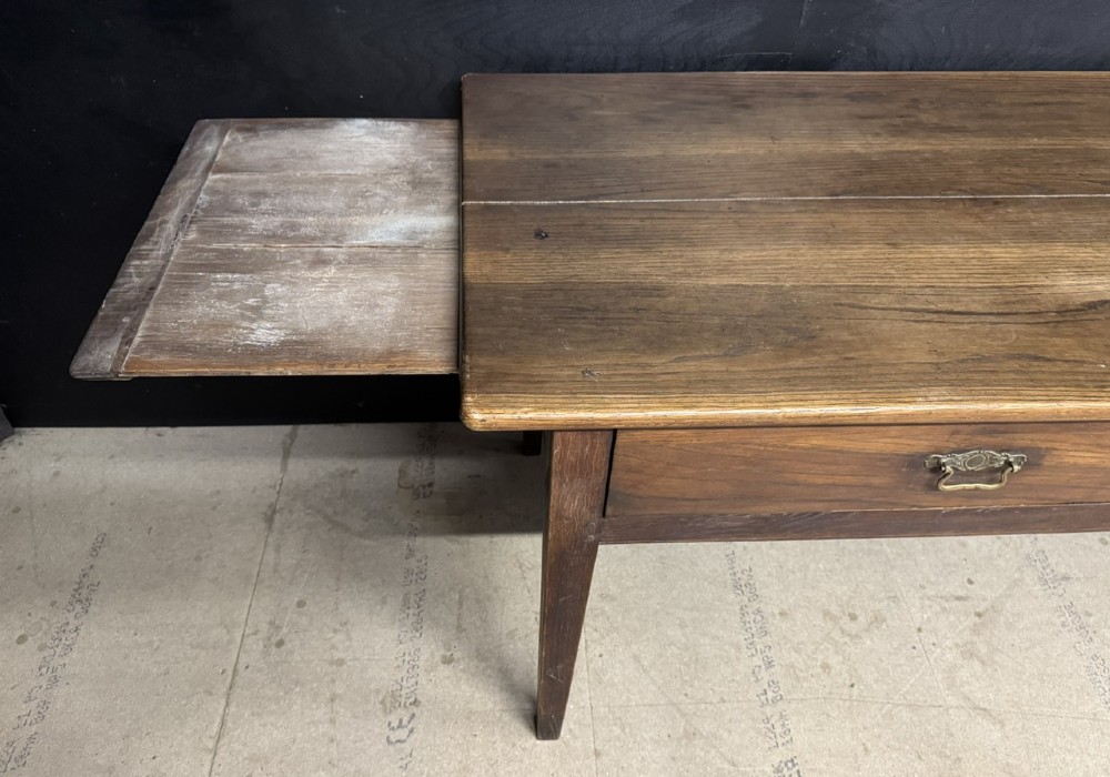 A rectangular antique French chestnut console prep table featuring two drawers with brass drop handles and square tapered legs. View XI