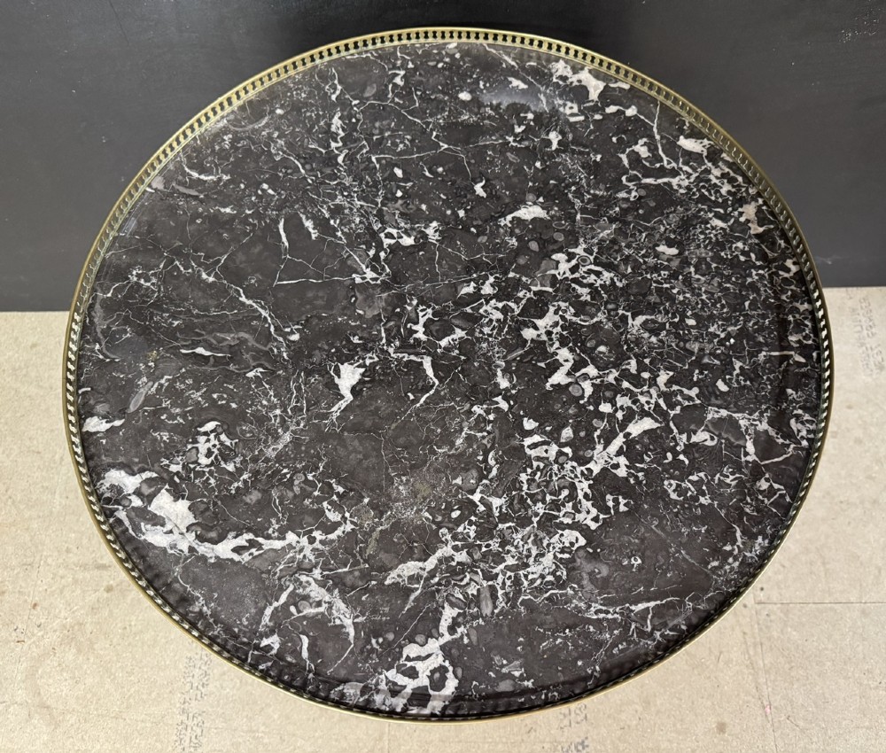 A circular French Louis XVI style lamp table featuring a dark veined marble top, a pierced brass gallery rim, a single drawer, and four square tapered legs. View II