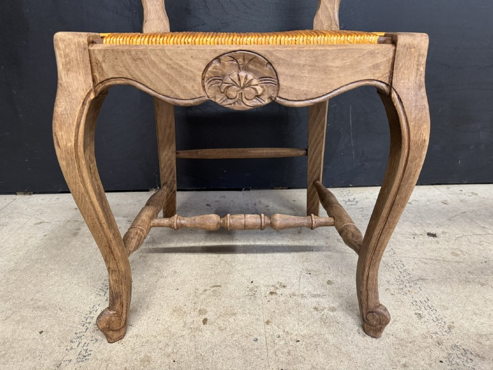 A set of eight French farmhouse dining chairs featuring carved wooden ladderback frames, woven rush seats, and cabriole front legs. View VIII