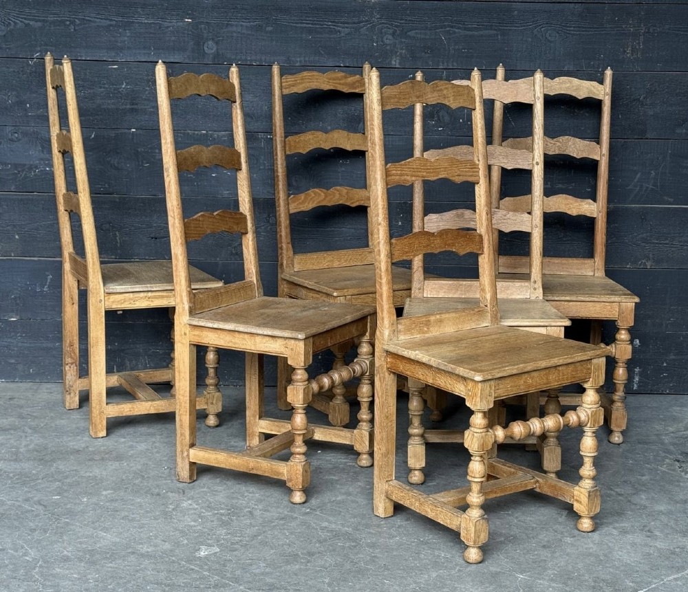 A set of six light oak ladderback dining chairs featuring wavy back slats, turned legs, and solid wooden seats. View VIII
