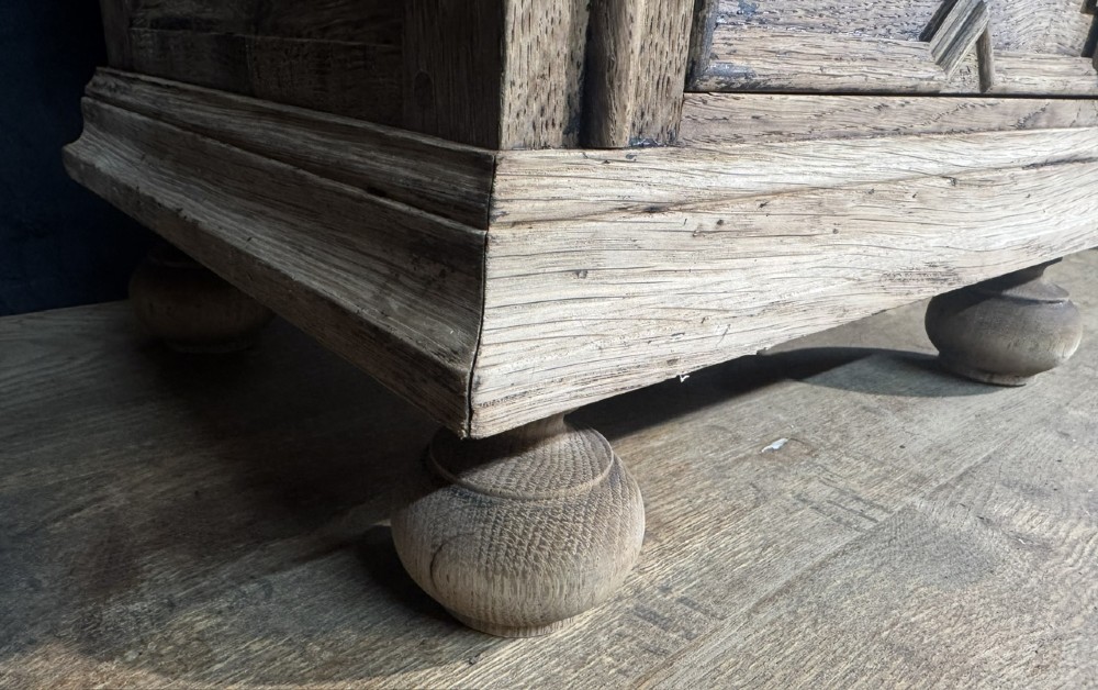 A pair of light oak three-drawer bedside chests with geometric carved drawer fronts, brass ring handles, and turned bun feet. View XI
