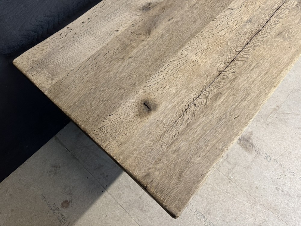 A large solid light oak dining table featuring an X-frame trestle base and a central key-joined stretcher. View VIII