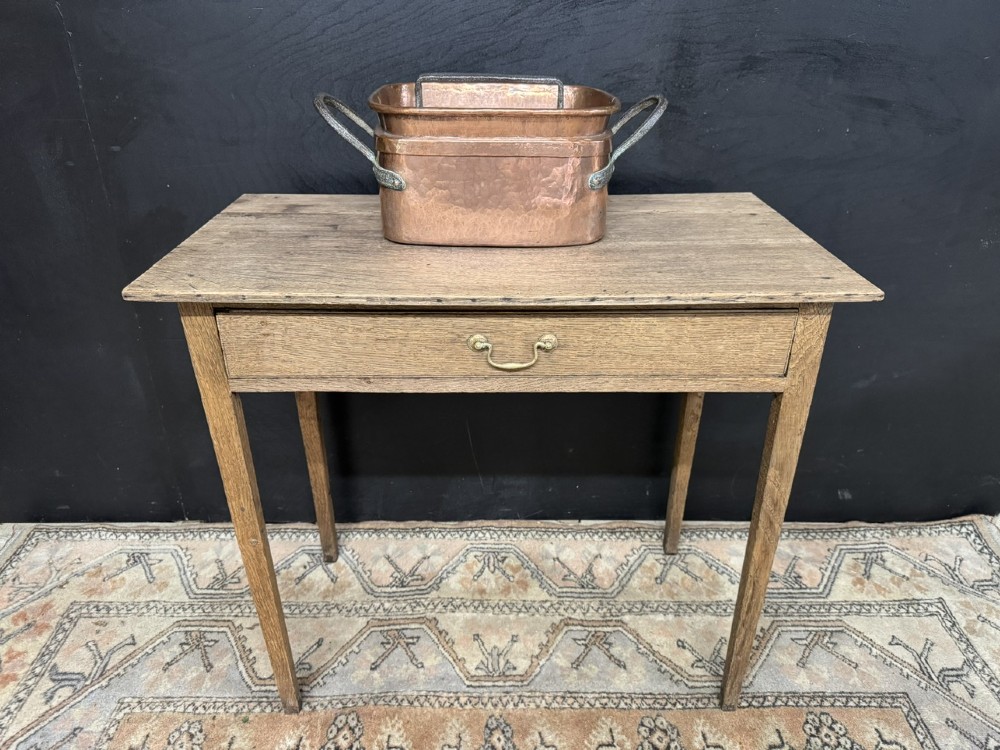 A Georgian oak side table featuring a single frieze drawer with a brass swan-neck handle and four square legs. View II