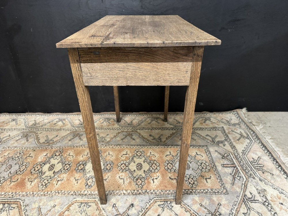 A Georgian oak side table featuring a single frieze drawer with a brass swan-neck handle and four square legs. View IX