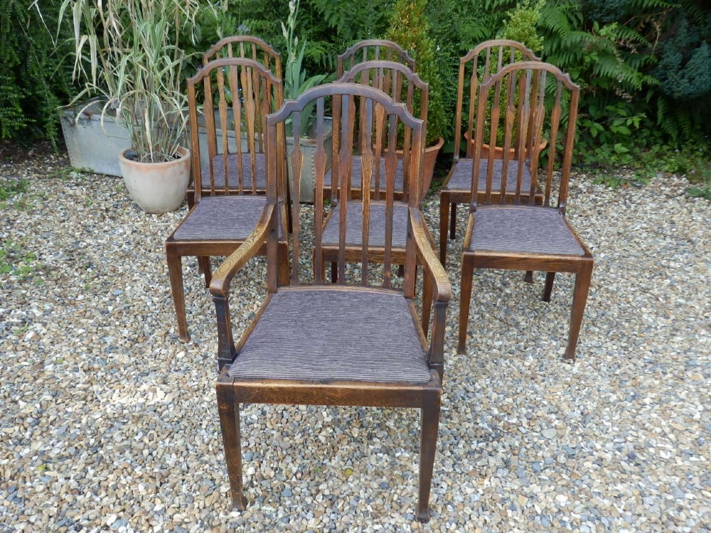 Dining chairs, set of 7 Shoolbred arts and crafts oak, beautiful condition.