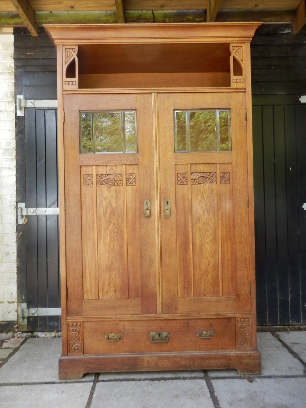Art Nouveau solid oak hall cupboard, 