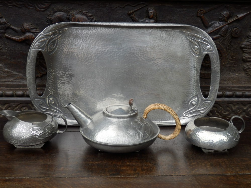 Tudric tea set designed by Archibold Knox, tea pot, sugar bowl, milk jug and tray