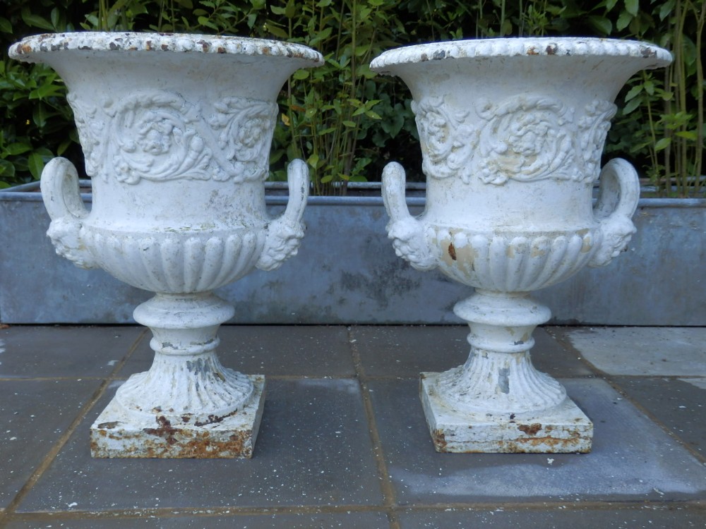 Cast iron garden urns, matching pair