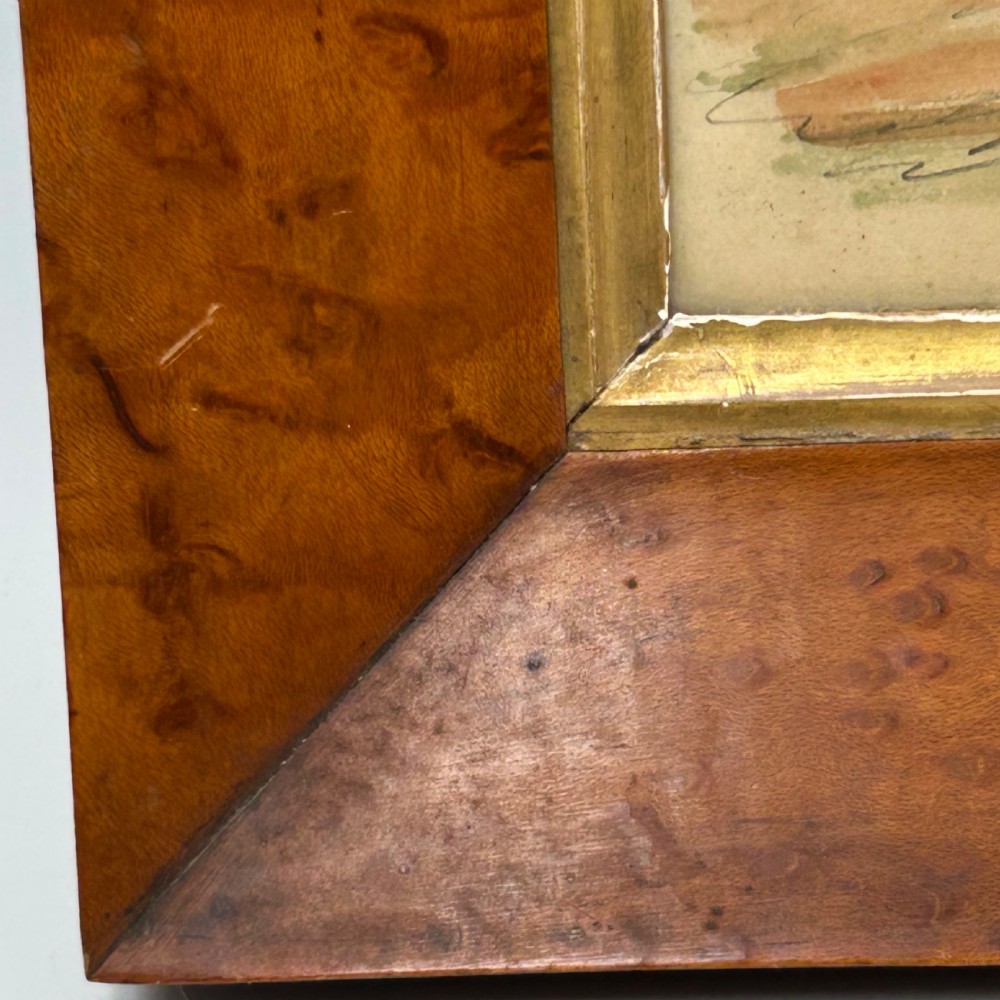 An antique watercolour portrait of a child wearing a green dress framed in figured maple wood with a gilded inner rim. View XII