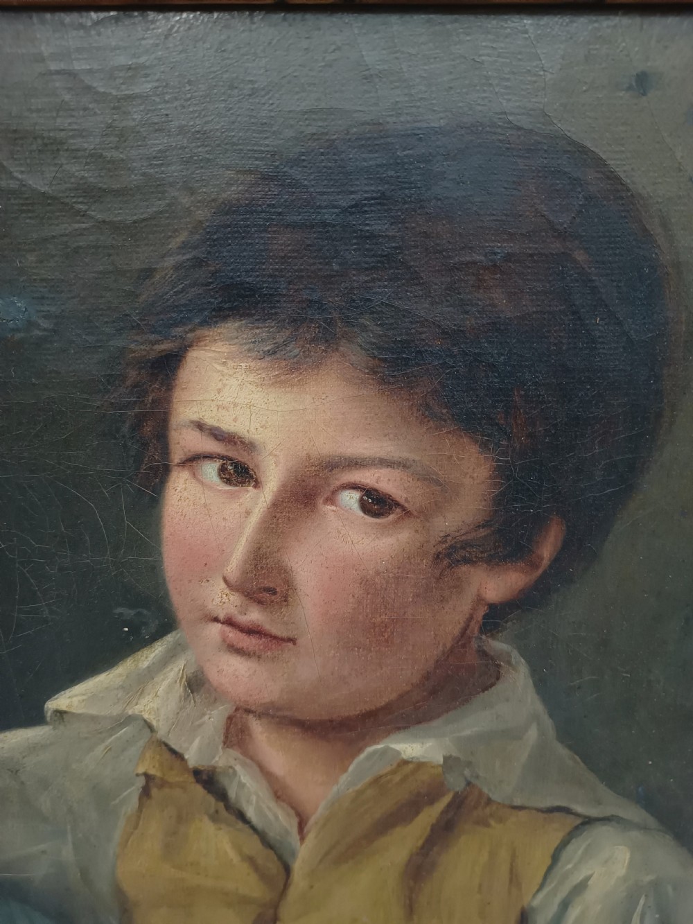 A Georgian era oil painting depicting two siblings in period attire within a moulded gold gilt frame. View V